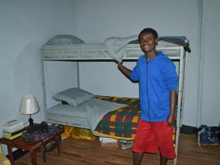 young-man-by-bunk-beds.jpg