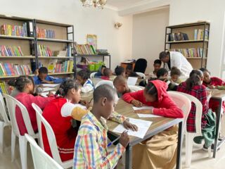 Ethiopian children studying in library