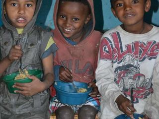 three-boys-with-their-porridge.jpg