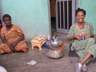 happy-women-by-teapot-with-cups.jpg