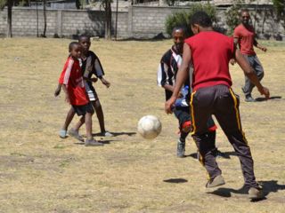 adults-and-kids-playing-soccer-together.jpg