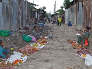 women-with-fruit-veggies-in-street.jpg