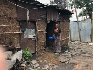 woman-at-doorway-of-house.jpg