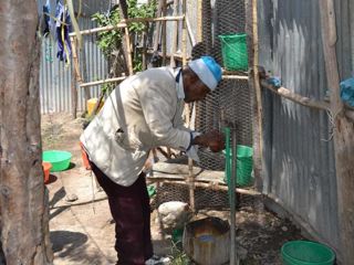 washing-hands-outside-chicken-coop.jpg