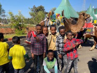 boys and camel at fieldtrip