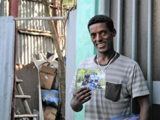 young-man-holding-christmas-card-from.jpg