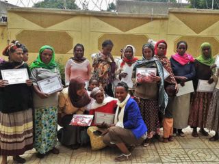 group-of-adults-holding-certificates.jpg