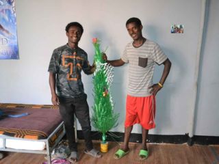 korah-guys-with-plastic-christmas-tree.jpg