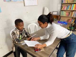teacher helping student