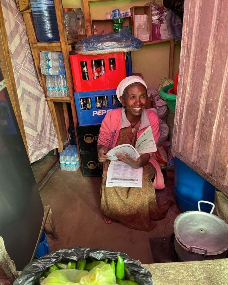 Woman smiling with book 